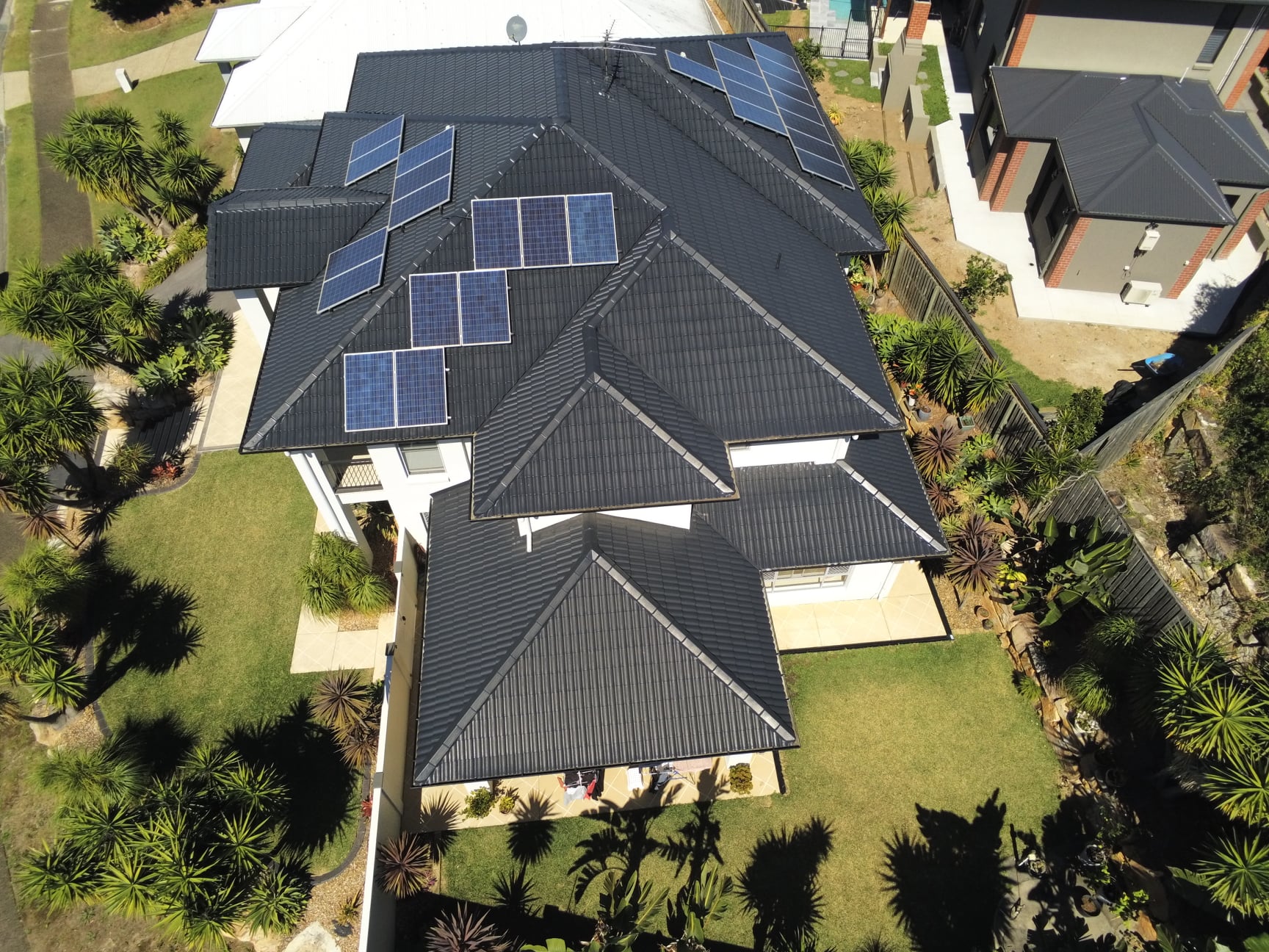 Aerial view of restored dark tile roof in Brisbane